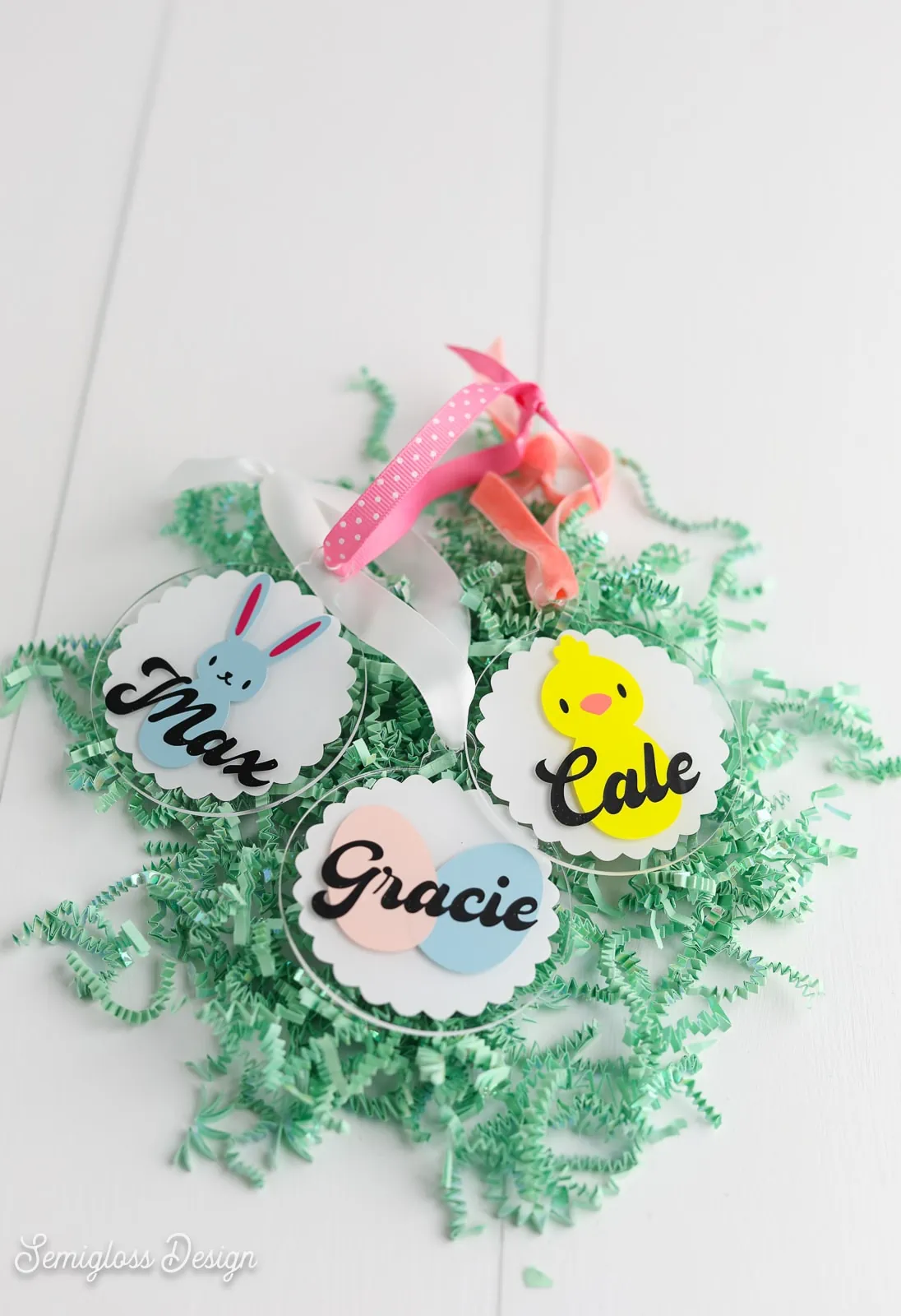 easter name tags on pile of paper grass