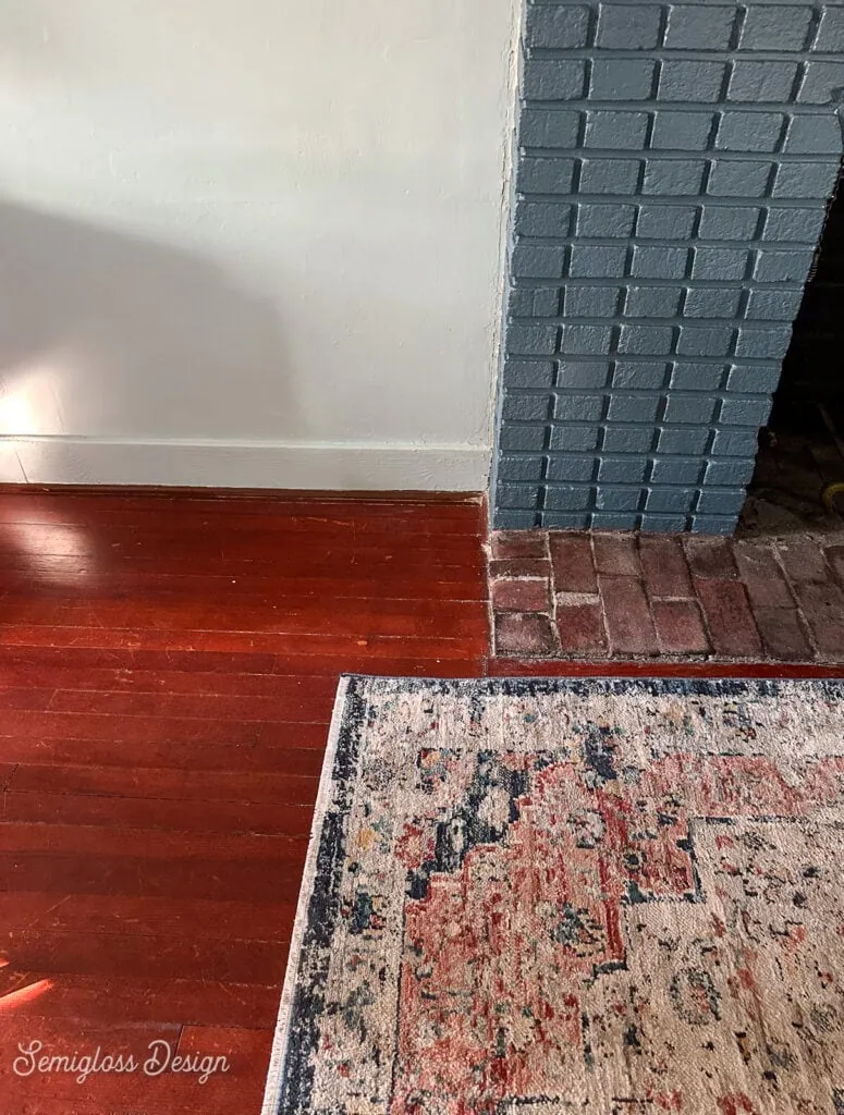 light rug on dark floor