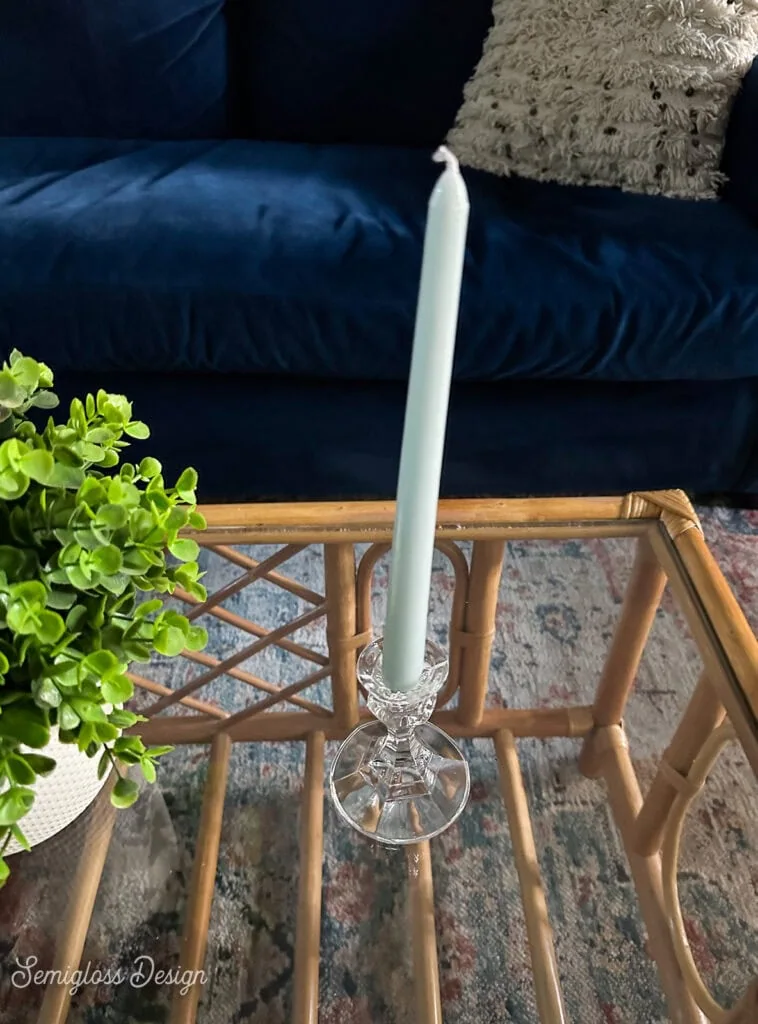 glass candleholder on glass coffee table