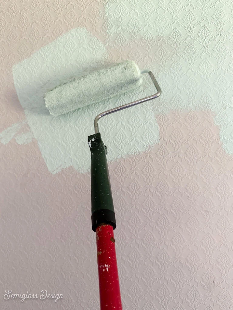 roller painting wall aqua