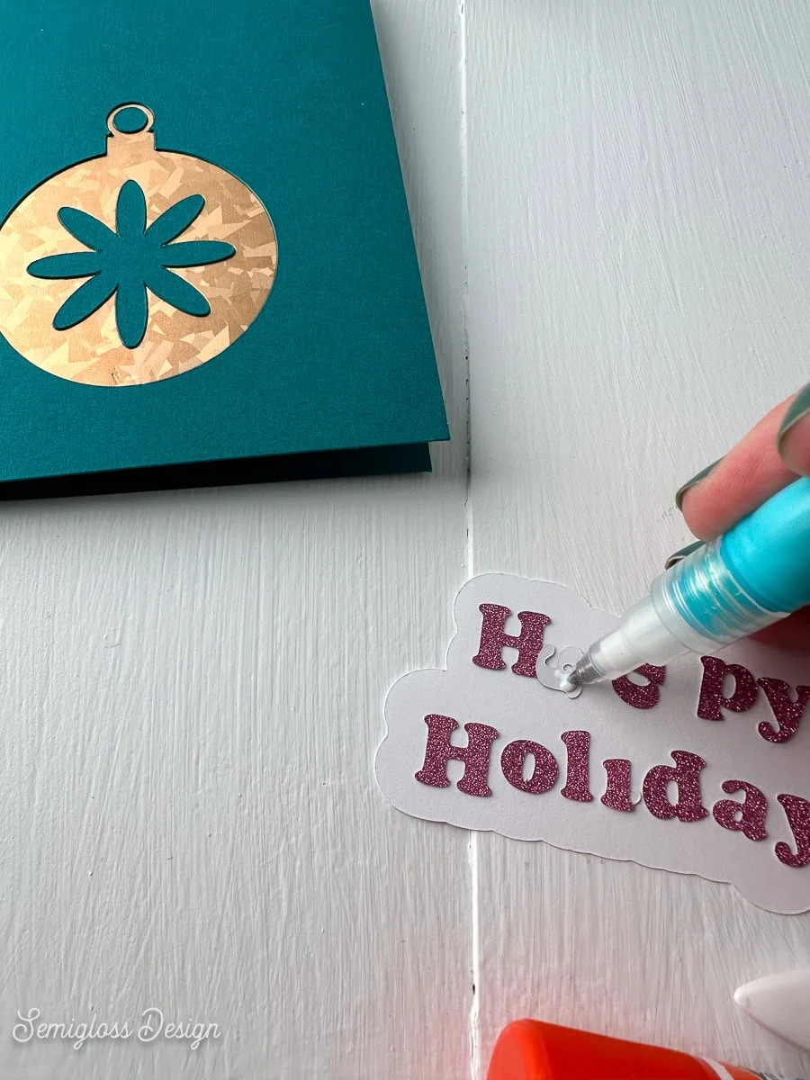 gluing letters with glue pen onto cardstock