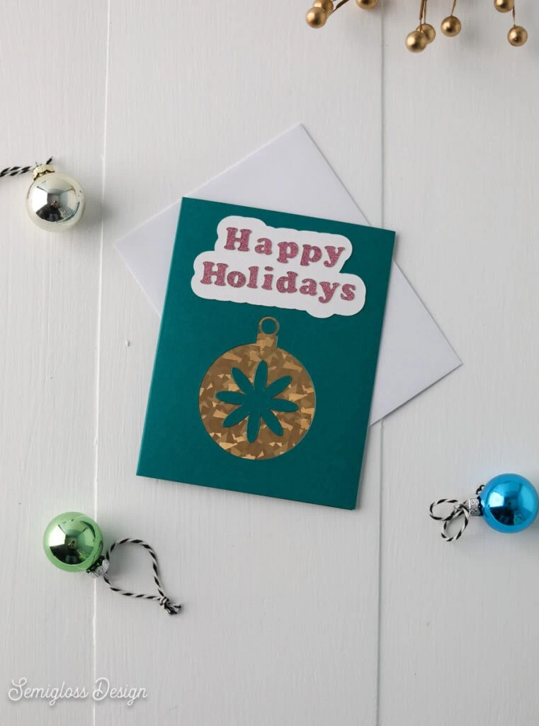 card with cutaway ornament