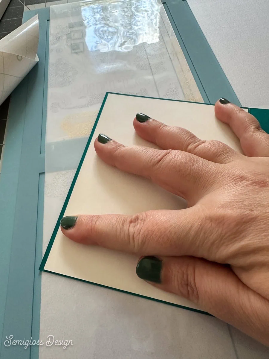 placing backer card on cutaway card
