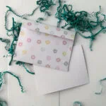 envelope with paper confetti
