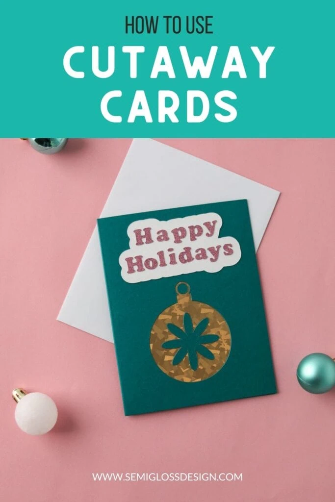 cutaway card with gold foil ornament and glitter lettering saying Happy Holidays