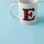 monogram letter E mug on blue background