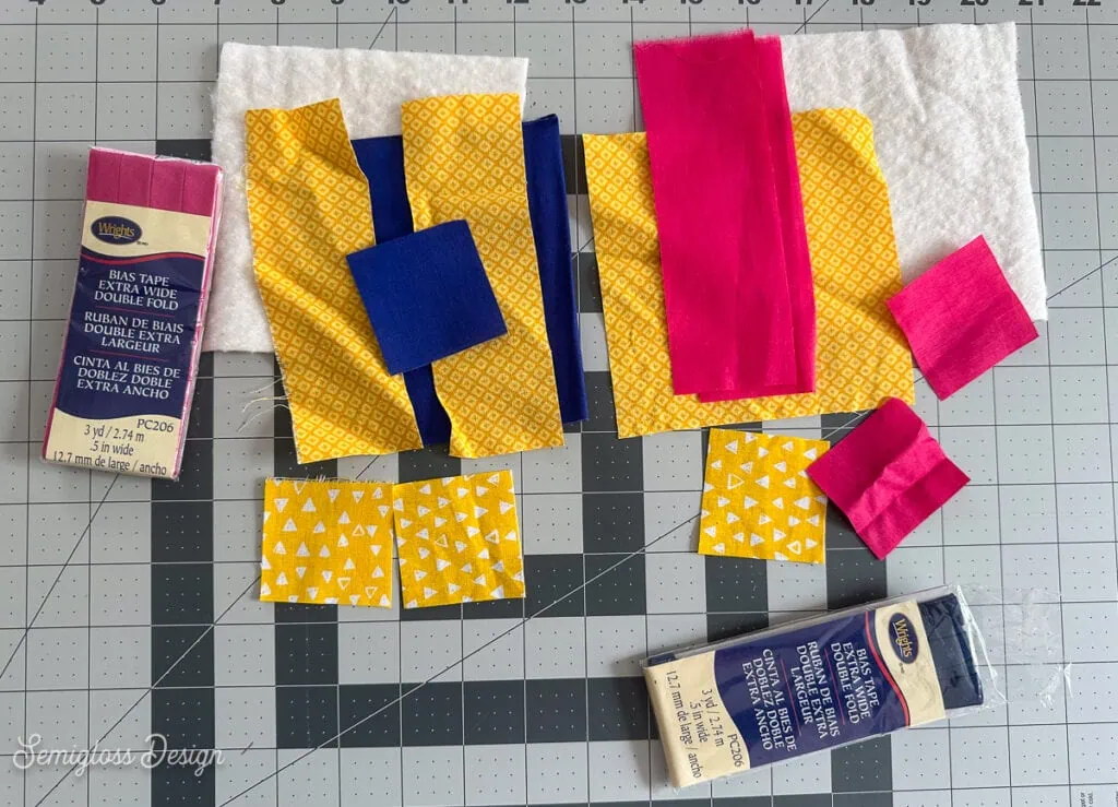 fabric, batting, and bias tape to make coasters