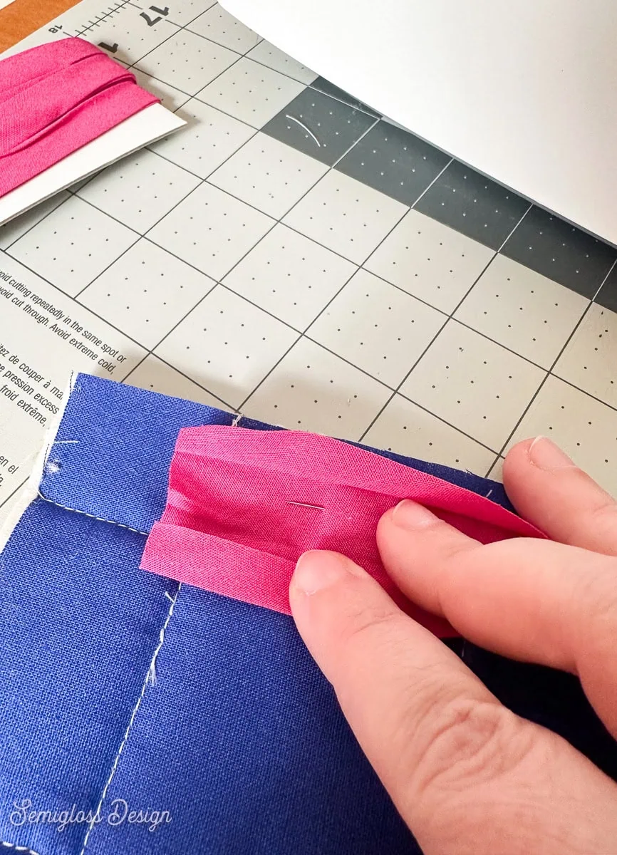 pink bias tape on back of coaster