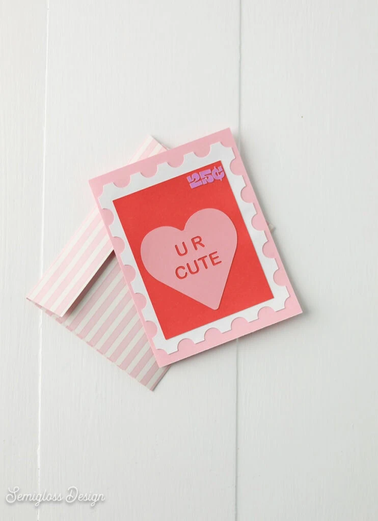 handmade Valentine's Day card with pink striped envelope