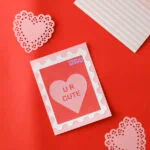 handmade card for Valentine's day with pink heart doilies