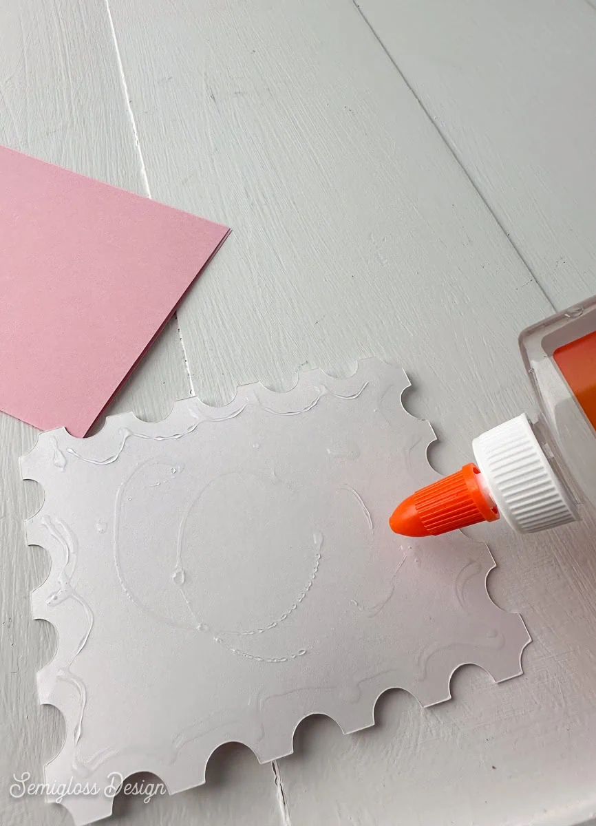 applying glue to back of card design