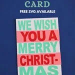 card with colorful paper lettering saying we wish you a merry christmas