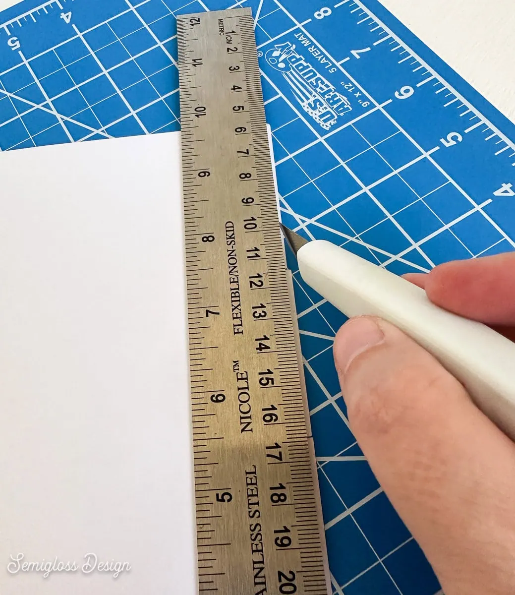 cutting excess paper from card