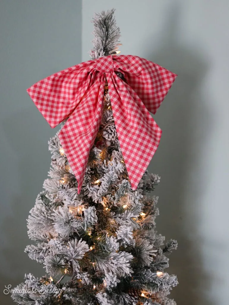 floppy pink fabric bow on christmas tree