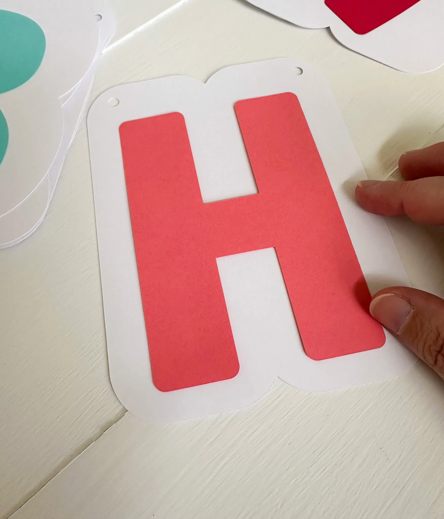 assembling letter H for happy birthday banner
