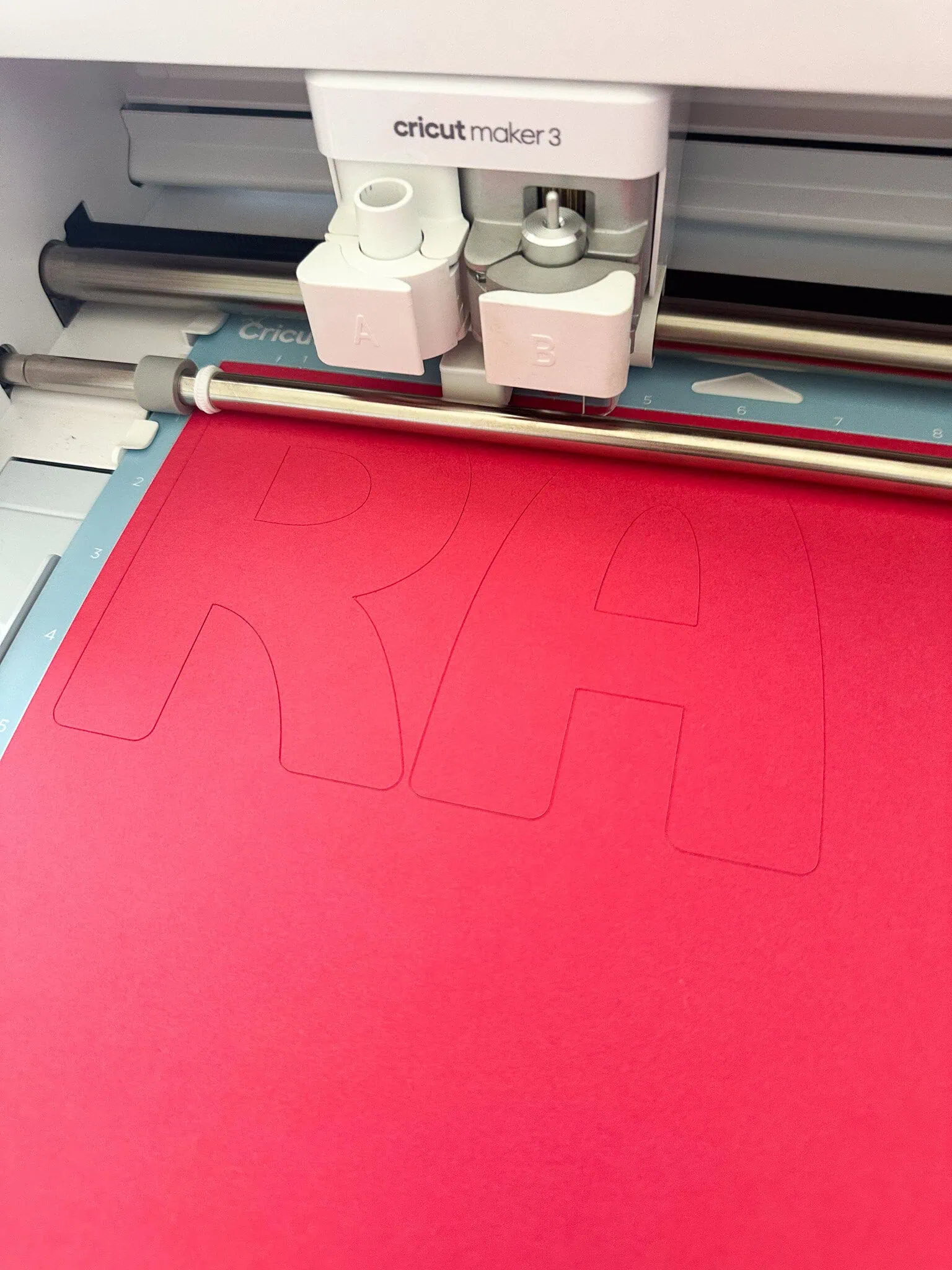 Cricut cutting red paper