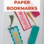 colorful paper bookmarks on white wooden background