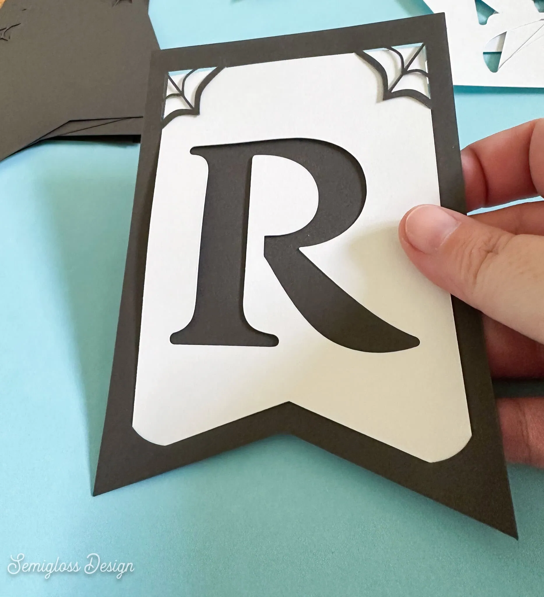 hand holding paper bunting piece