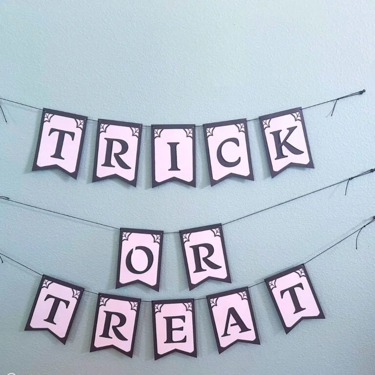 trick or treat paper banner on aqua wall