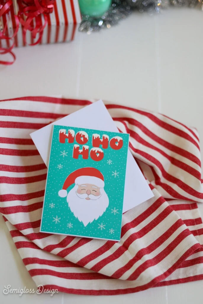 Santa card with snowflakes and "Ho Ho Ho" lettering