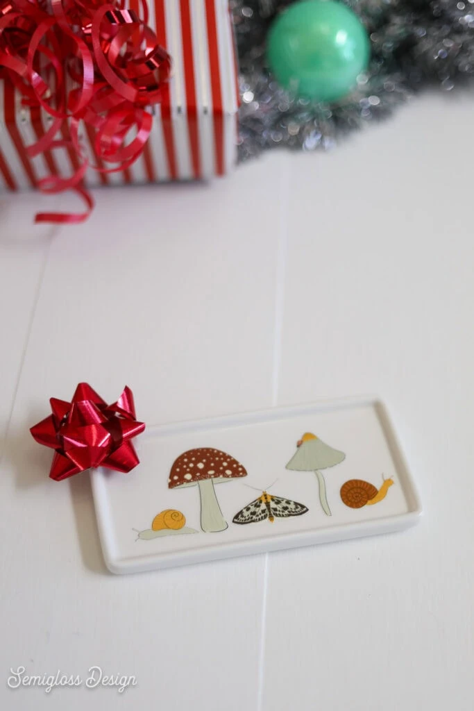 ceramic tray with mushrooms, snails, and a moth print