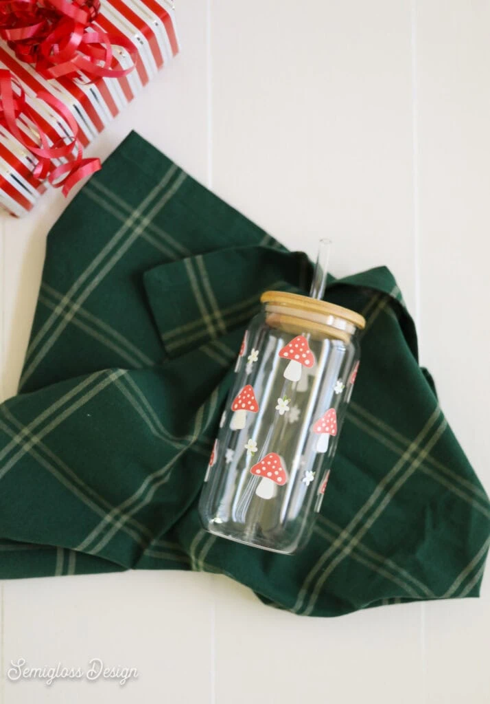 mushroom glass tumbler on green plaid towel