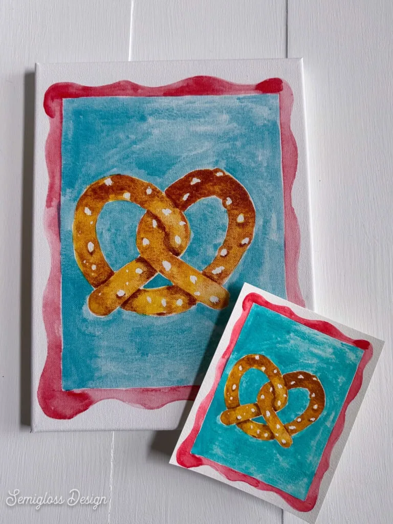 canvas with watercolor print of pretzel with original painting on paper