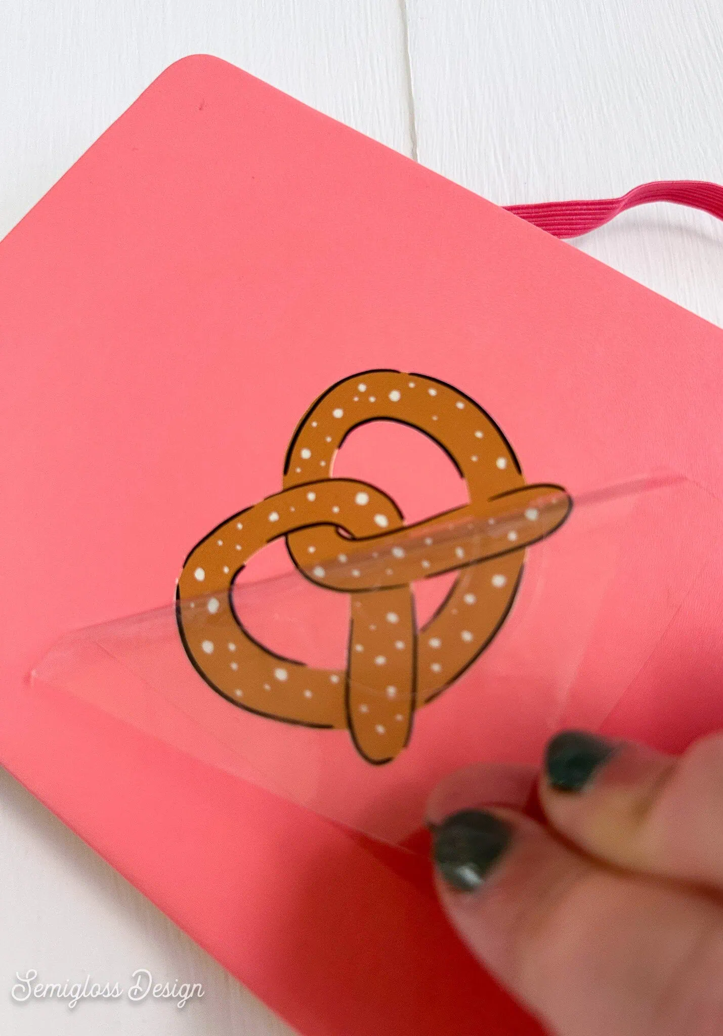 applying pretzel decal to journal
