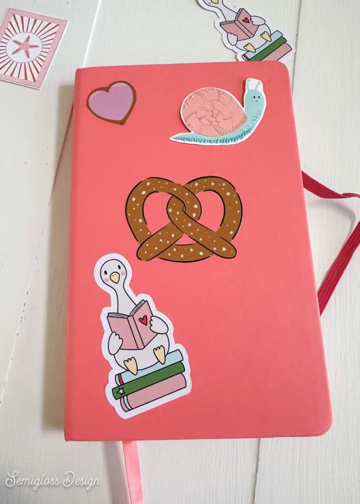 stickers on pink journal