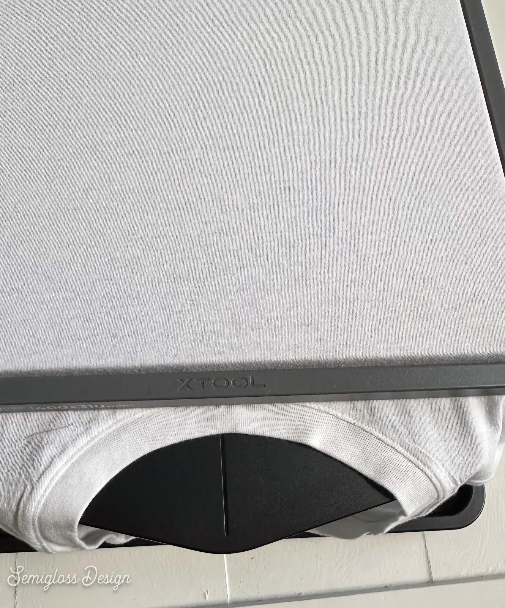 white shirt on xTool O1 Omni garment tray